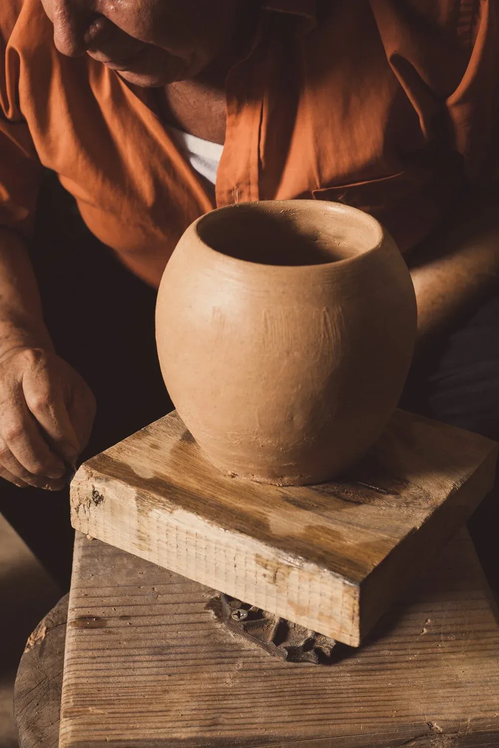 Shaping table covered with clay pieces in progress